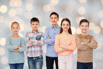 Image showing happy smiling children over holidays lights