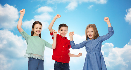 Image showing happy boy and girls celebrating victory