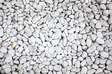 Image showing White stones at a grave as a background