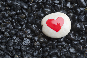 Image showing Red heart on white stone