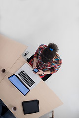 Image showing top view of young business woman working on laptop