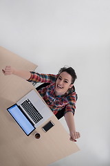 Image showing top view of young business woman working on laptop