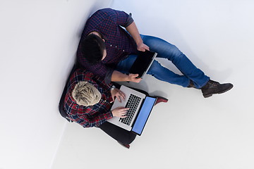 Image showing top view of  couple working on laptop computer at startup office