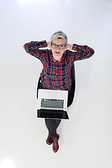 Image showing top view of young business woman working on laptop computer