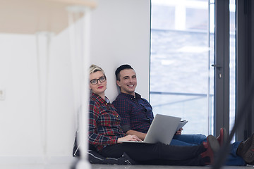 Image showing startup business, couple working on laptop computer at office