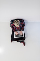 Image showing top view of young business woman working on laptop computer