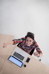 Image showing top view of young business woman working on laptop