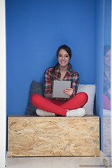 Image showing woman in crative box working on tablet