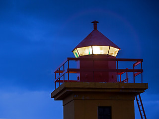 Image showing Closeup of the top of an orange lighthouse