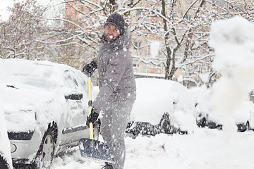 Image showing Man shoveling snow in winter.