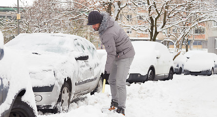 Image showing Man shoveling snow in winter.