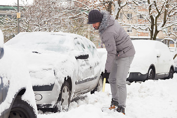 Image showing Man shoveling snow in winter.