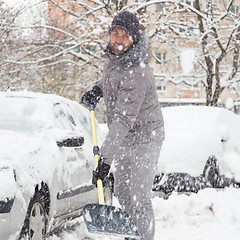 Image showing Man shoveling snow in winter.