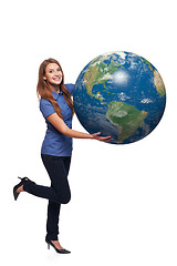 Image showing Woman in full length holding earth globe