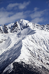 Image showing Snowy mountain peak at sunny day