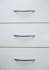 Image showing Cabinet with sliding trays and chrome handles