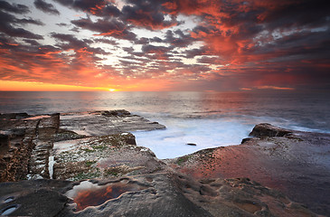 Image showing Summer sunrise over Maroubra and reflections