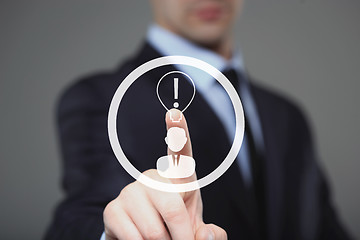 Image showing business, technology concept - businessman pressing button with bulb on virtual screens