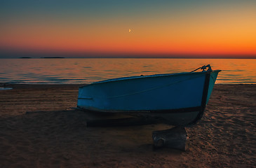 Image showing Boat on the beach at sunset background