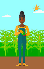 Image showing Farmer holding corn.