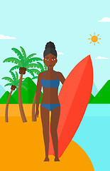 Image showing Surfer holding surfboard.