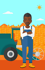 Image showing Man standing with combine on background.