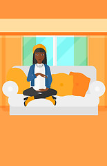 Image showing Pregnant woman sitting on sofa.