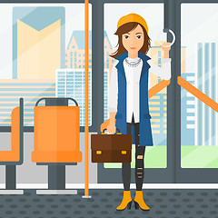 Image showing Woman standing inside public transport.