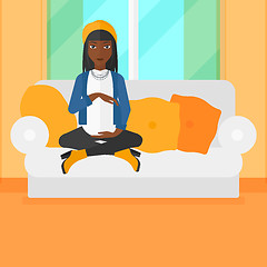 Image showing Pregnant woman sitting on sofa.