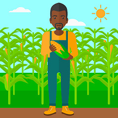 Image showing Farmer holding corn.