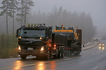 Image showing Volvo FM Semi Hauls Crawler Excavator in Fog