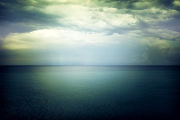 Image showing Light in the sky above the dark gloomy sea