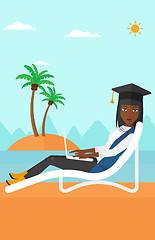 Image showing Graduate lying on chaise lounge with laptop.