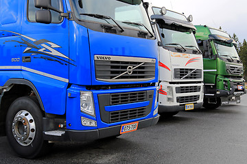 Image showing Row of Colorful Volvo Trucks