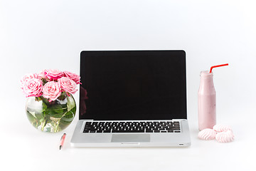 Image showing Comfortable workplace with laptop on white