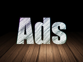 Image showing Advertising concept: Ads in grunge dark room