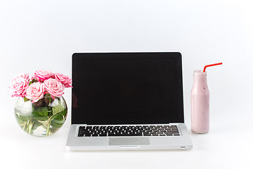 Image showing Comfortable workplace with laptop on white