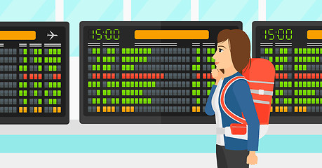 Image showing Woman looking at schedule board.