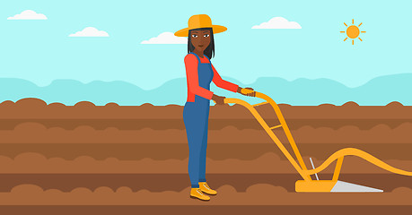 Image showing Farmer on the field with plough.