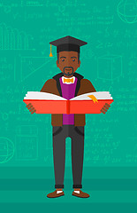 Image showing Man in graduation cap holding book.