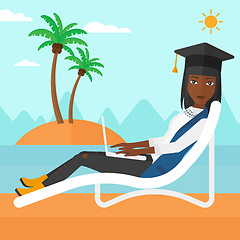 Image showing Graduate lying on chaise lounge with laptop.