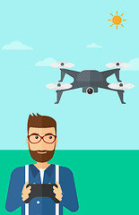 Image showing Man flying drone.