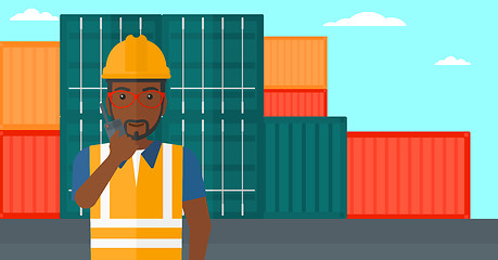 Image showing Stevedore standing on cargo containers background.