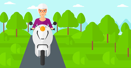 Image showing Woman riding scooter.