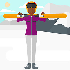 Image showing Woman holding skis.