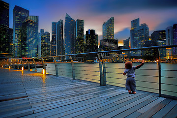 Image showing Little boy in a big city 