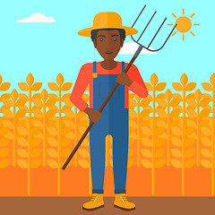 Image showing Farmer with pitchfork.