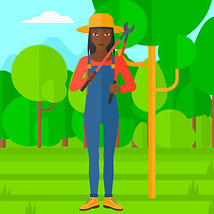 Image showing Farmer with pruner in garden.