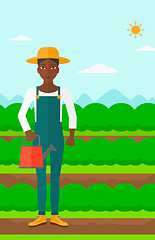 Image showing Farmer with watering can.