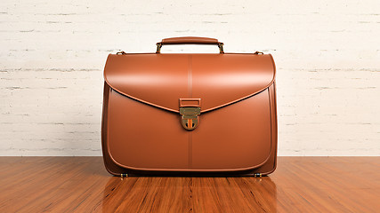 Image showing Office desk table with briefcase